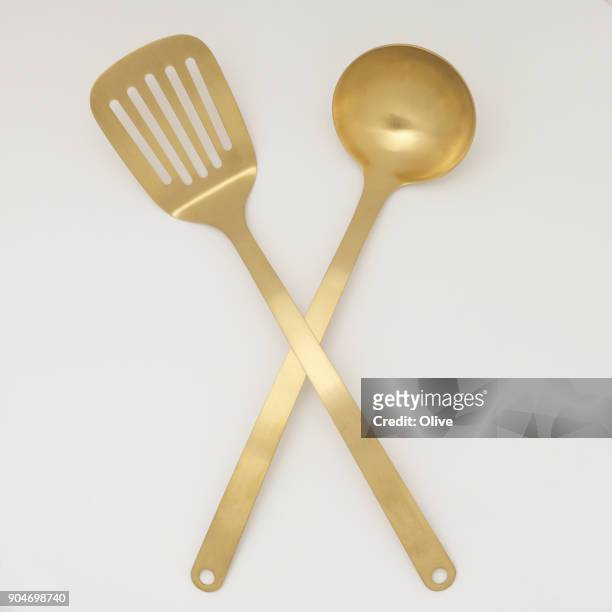 golden cutleries - spatula stock pictures, royalty-free photos & images