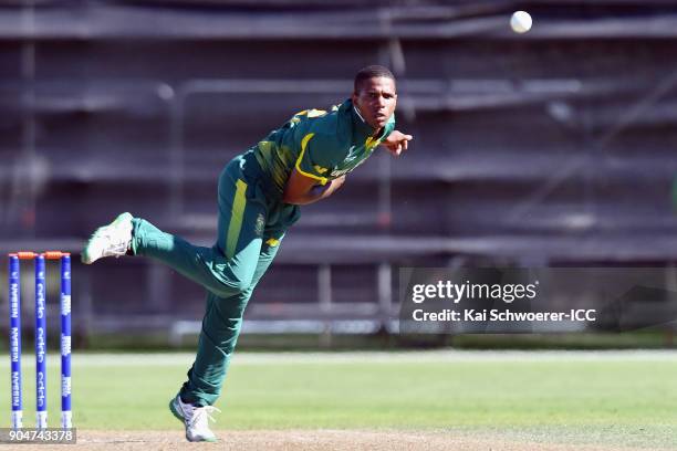 Kenan Smith of South Africa bowls during the ICC U19 Cricket World Cup match between South Africa and Kenya at Lincoln Green on January 14, 2018 in...