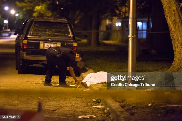 Chicago police officer investigates where Catherine Saterfield-Buchanan was found dead with blunt force trauma to the face and defensive wounds on...