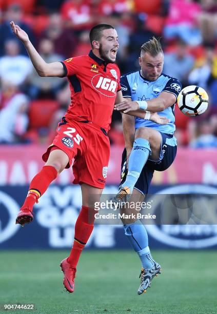 Apostolos Stamatelopoulos of Adelaide United competes with Jordy Buijs of Sydney FC during the round 16 A-League match between Adelaide United and...