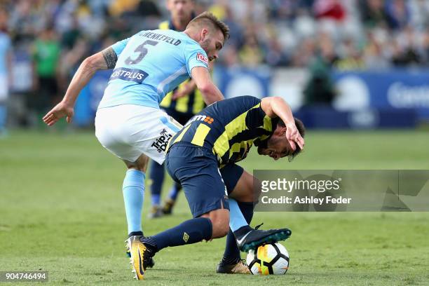 Asdrubal of the Mariners is contested by Ben Schenkeveld of Melbourne City during the round 16 A-League match between the Central Coast Mariners and...