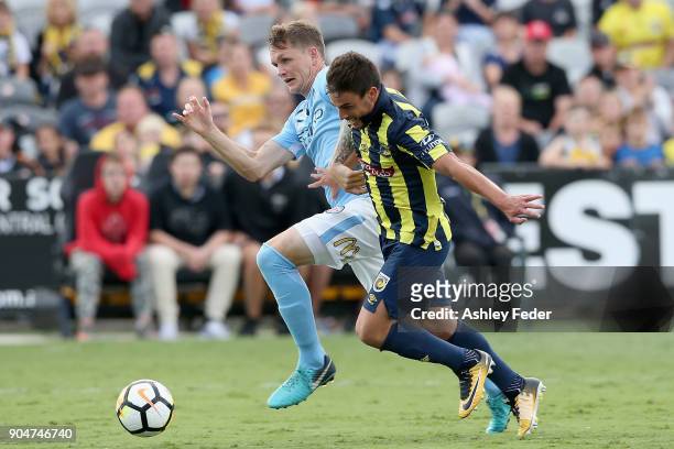 Michael Jakobsen of Melbourne City is constested by Asdrubal of the Mariners during the round 16 A-League match between the Central Coast Mariners...