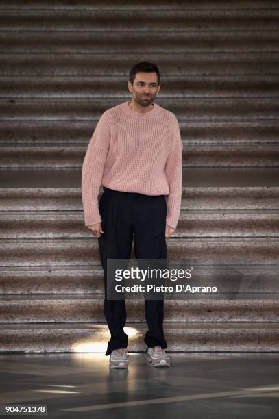 Designer Massimo Giorgetti acknowledges the applause of the audience at the MSGM show during Milan Men's Fashion Week Fall/Winter 2018/19 on January...