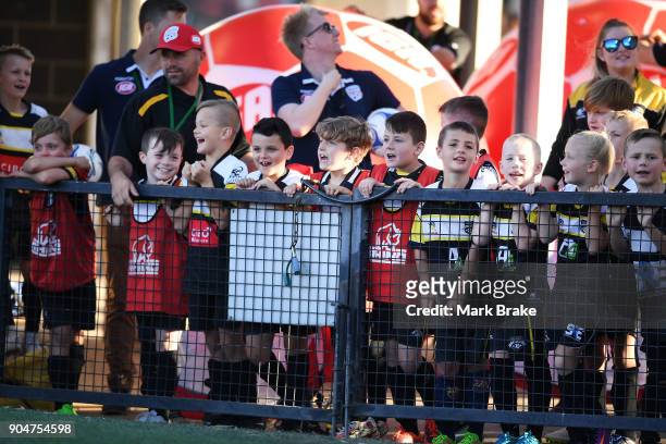 Junior soccer players wait fornthe half time break during the round 16 A-League match between Adelaide United and Sydney FC at Coopers Stadium on...