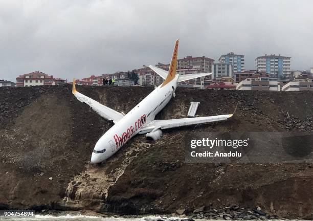 Pegasus airplane is seen stuck in mud as it skidded off the runway after landing in Trabzon Airport, Turkey early Sunday on January 14, 2018. 162...