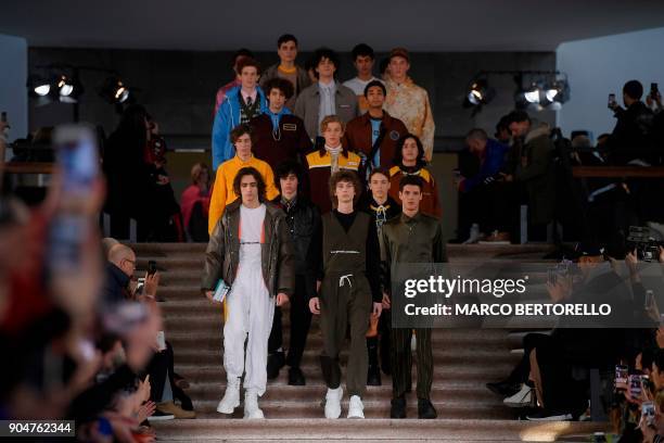 Models present creations for fashion house MSGM during the Men's Fall/Winter 2019 fashion show in Milan, on January 14, 2018. / AFP PHOTO / Marco...