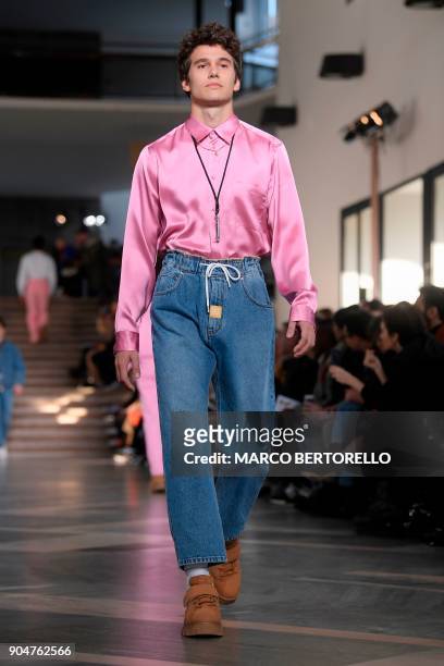 Model present a creation for fashion house MSGM during the Men's Fall/Winter 2019 fashion show in Milan, on January 14, 2018. / AFP PHOTO / Marco...