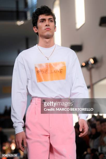 Model presents a creation for fashion house MSGM during the Men's Fall/Winter 2019 fashion show in Milan, on January 14, 2018. / AFP PHOTO / Marco...