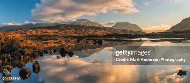 lochan na h-achlaise reflections panoramic #1 - lochan na h'achlaise stock pictures, royalty-free photos & images