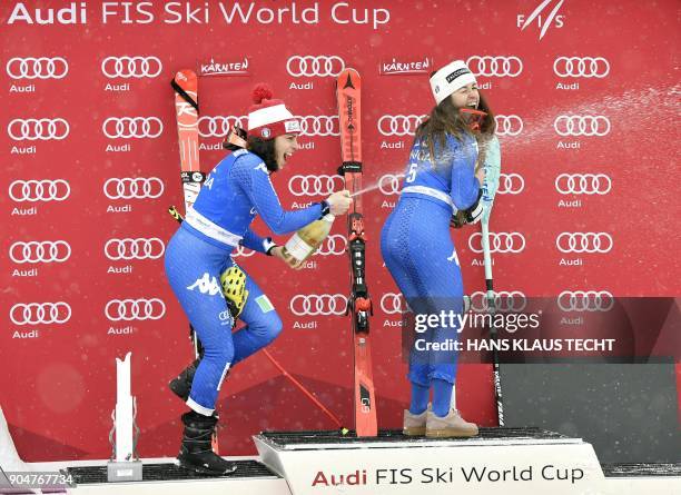 Second placed Federica Brignone of Italy and winner Sofia Goggia of Italy celebrate on the podium of the FIS Alpine World Cup Women downhill...