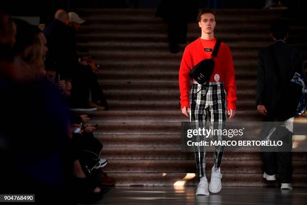 Model presents a creation for fashion house MSGM during the Men's Fall/Winter 2019 fashion show in Milan, on January 14, 2018. / AFP PHOTO / Marco...