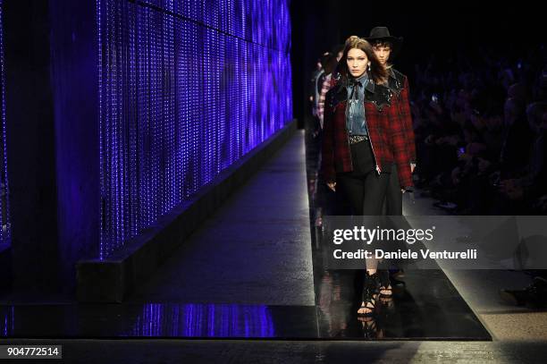 Bella Hadid walks the runway at the Dsquared2 show during Milan Men's Fashion Week Fall/Winter 2018/19 on January 14, 2018 in Milan, Italy.