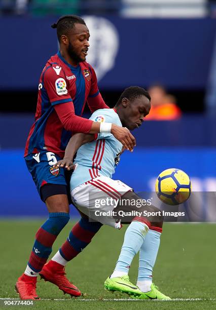 Cheik Doukoure of Levante competes for the ball with Pione Sixto of Celta de Vigo during the La Liga match between Levante and Celta de Vigo at...