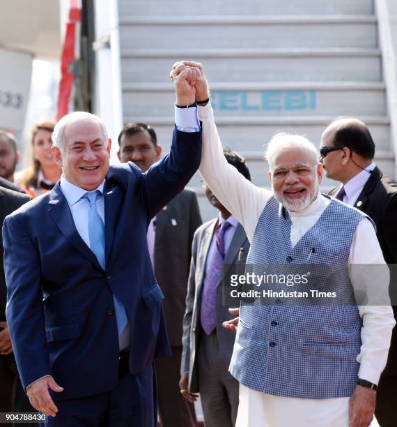 Prime Minister Narendra Modi welcomes Israeli Prime Minister Benjamin Netanyahu on his arrival at the Air Force Palam airport Station on January 14,...
