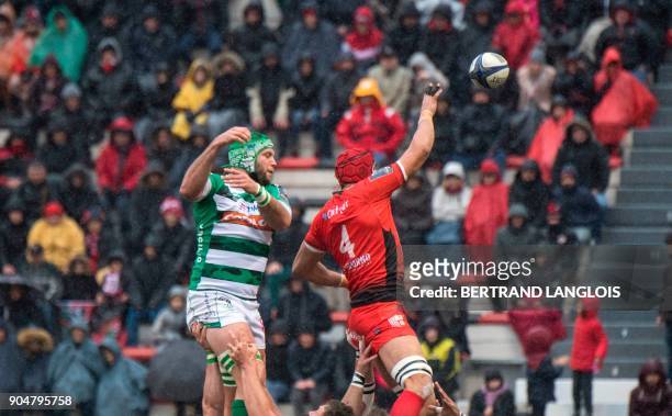 Toulon's South African lock Juandre Kruger and Treviso's South African lock Irne Herbst jump for the ball in a line out during the Champions Cup...
