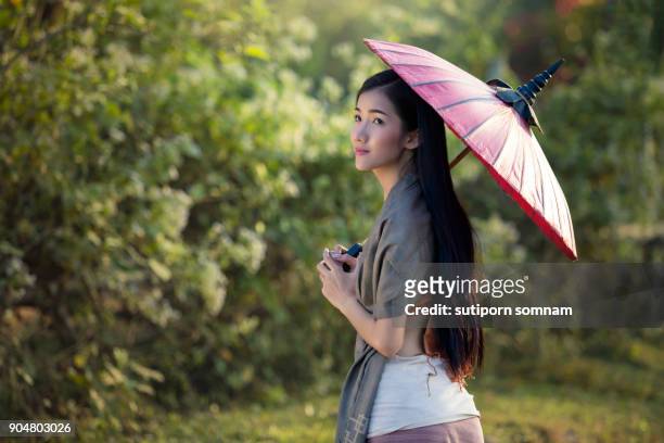 beautiful women dressed in traditional costumes - costumer stock pictures, royalty-free photos & images