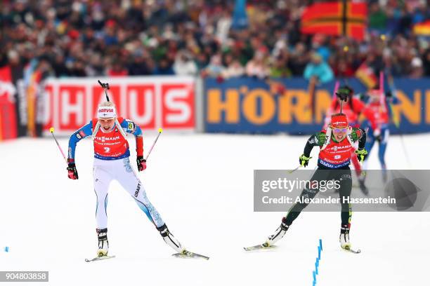 Kaisa Makarainen of Finland comepetes to win against Laura Dahlmeier of Germany during the women's 12,5 km mass start competition during the IBU...