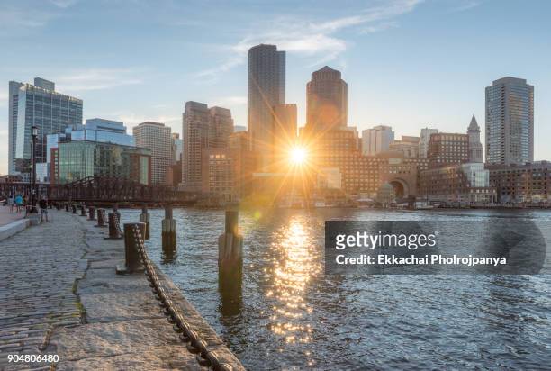 boston skyline and the harborwalk - boston harbor stock-fotos und bilder