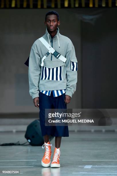 Model presents a creation for fashion house Sunnei during the Men's Fall/Winter 2019 fashion shows in Milan, on January 14, 2018. / AFP PHOTO /...