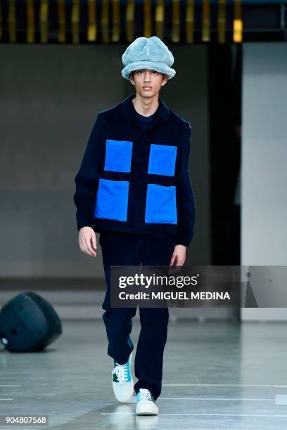 Model presents a creation for fashion house Sunnei during the Men's Fall/Winter 2019 fashion shows in Milan, on January 14, 2018. / AFP PHOTO /...