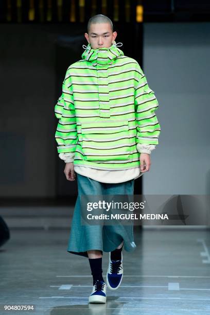 Model presents a creation for fashion house Sunnei during the Men's Fall/Winter 2019 fashion shows in Milan, on January 14, 2018. / AFP PHOTO /...