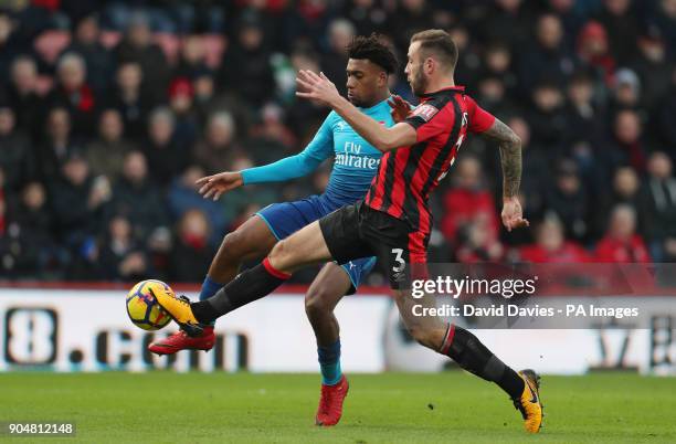 Arsenal's Alex Iwobi is tackled by Bournemouth's Steve Cook during the Premier League match at the Vitality Stadium, Bournemouth.