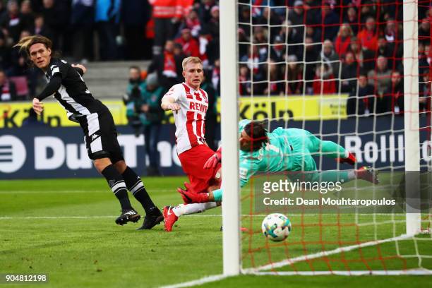 Frederik Sorensen of FC Koeln shoots and scores a goal past Goalkeeper, Yann Sommer of Borussia Monchengladbach during the Bundesliga match between...