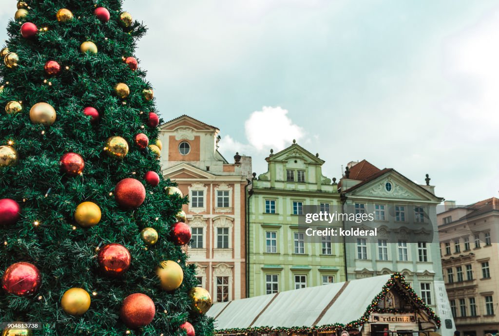 Historic buildings in old town of Prague. With Christmas tree and market