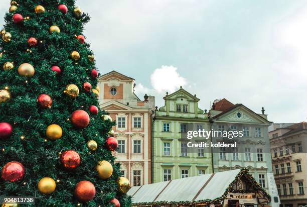 historic buildings in old town of prague. with christmas tree and market - prague christmas market old town stock pictures, royalty-free photos & images