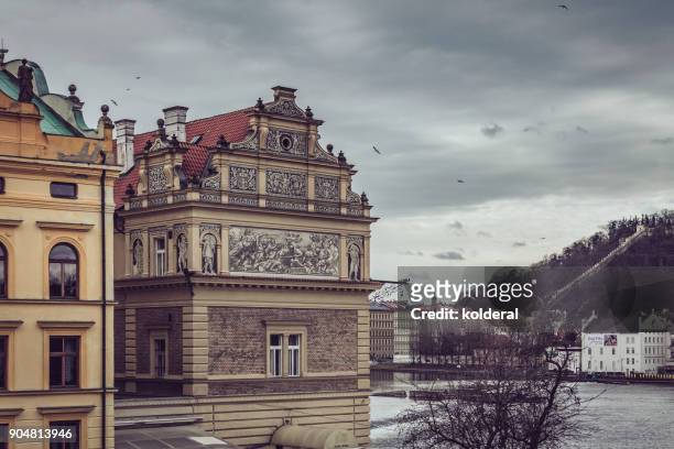 historic buildings in old town of prague. as seen from charles bridge on the banks of vltava river. - prague christmas market old town stock pictures, royalty-free photos & images
