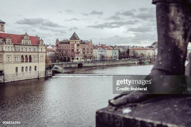 historic buildings in old town of prague. as seen from charles bridge on the banks of the vltava river - prague christmas market old town stock pictures, royalty-free photos & images