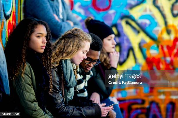 teens with technology - city life stock pictures, royalty-free photos & images