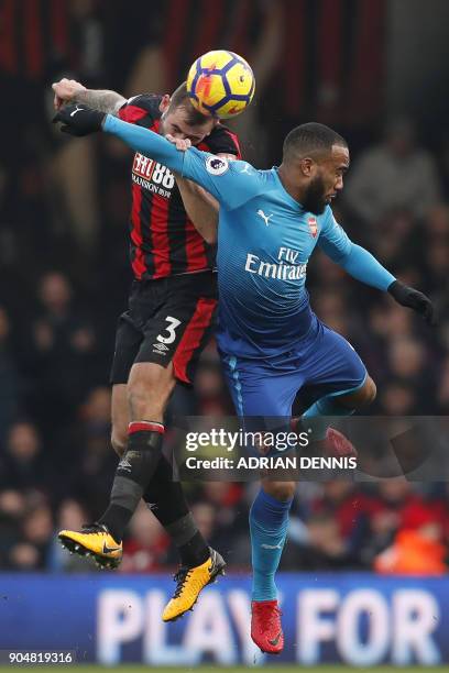 Bournemouth's English defender Steve Cook vies with Arsenal's French striker Alexandre Lacazette during the English Premier League football match...