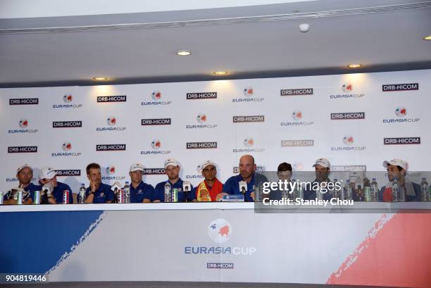 Europe Captain Thomas Bjorn speaks and the Europe team players looks on during the post match press conference after the presentation ceremony...