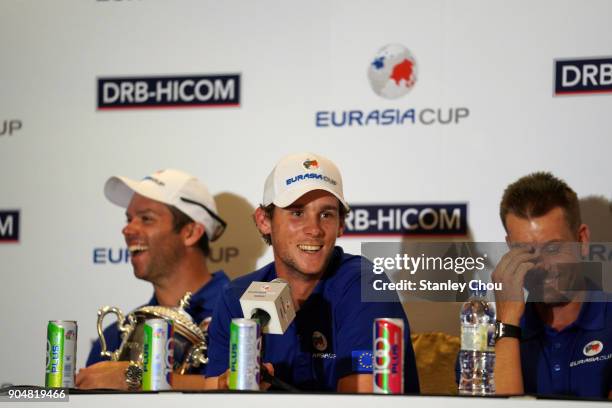 Thomas Pieters of teanm Europe speaks while Paul Casey and Henrik Stensen laughs during the post match press conference after the presentation...