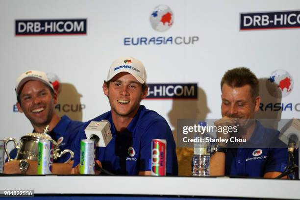 Thomas Pieters of teanm Europe speaks while Paul Casey and Henrik Stensen laughs during the post match press conference after the presentation...