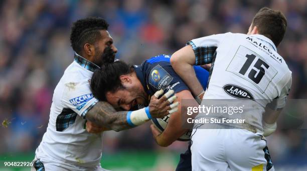 Leinster wing James Lowe is collared by both Isa Nacewa and Ruaridh Jackson during the European Rugby Champions Cup match between Leinster Rugby and...