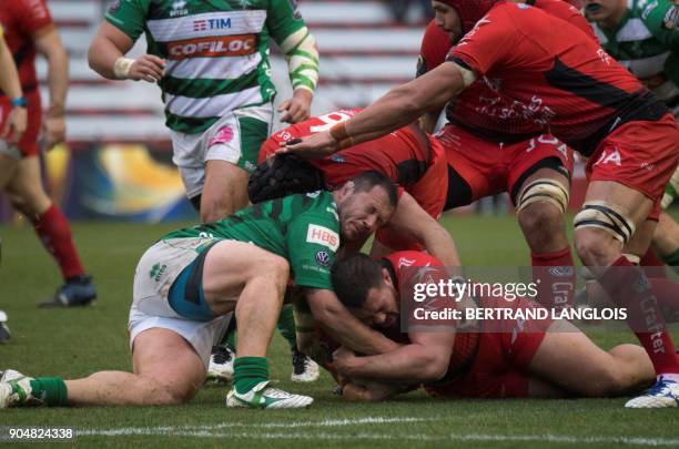 Toulon's South African prop Marcel Van Der Merwe vies with Treviso's fly-half Ian McKinley during the Champions Cup rugby union match RC Toulon vs...