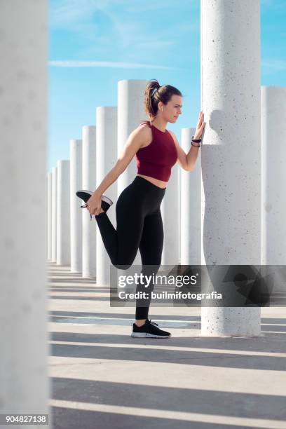 girl warming up - fastening stock pictures, royalty-free photos & images