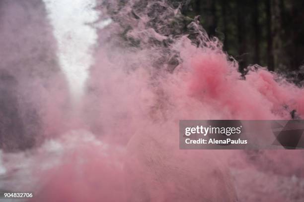 young woman portrait outdoors with pink smoke bomb - frank wood stock pictures, royalty-free photos & images