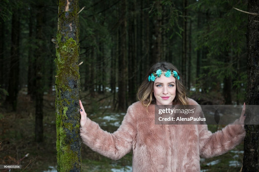 Young woman portrait outdoors in the forest