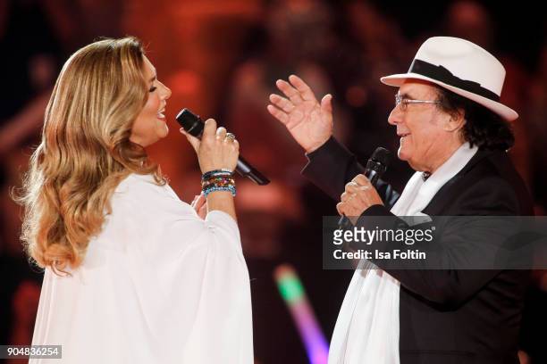 Italian duo Al Bano and Romina Power perform at the 'Schlagerchampions - Das grosse Fest der Besten' TV Show at Velodrom on January 13, 2018 in...