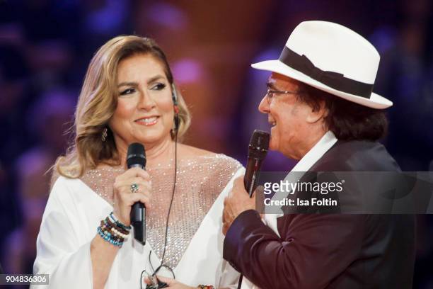 Italian duo Al Bano and Romina Power perform at the 'Schlagerchampions - Das grosse Fest der Besten' TV Show at Velodrom on January 13, 2018 in...