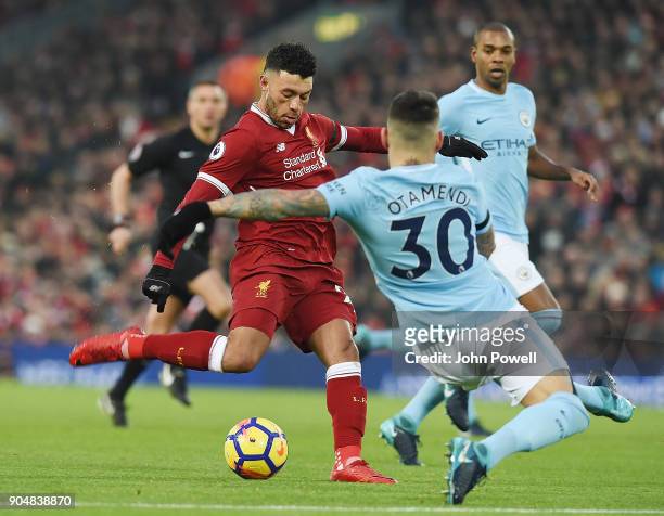Alex Oxlade-Chamberlain of Liverpool Scores the opener during the Premier League match between Liverpool and Manchester City at Anfield on January...