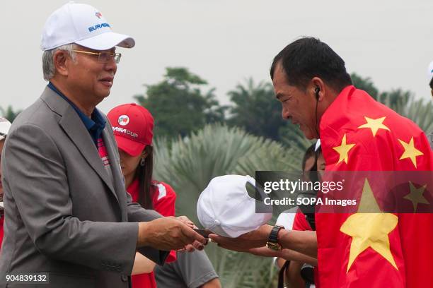 Zhang Lainwei seen receiving a ceremonial gift from the Malaysia Prime Minister Najib Razak. EurAsia Cup is a biennial men professional team golf...