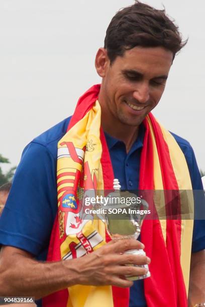 Rafa Cabrera Bello seen smiling while looking at his Eurasia Cup ceremonial gift. EurAsia Cup is a biennial men professional team golf tournament...