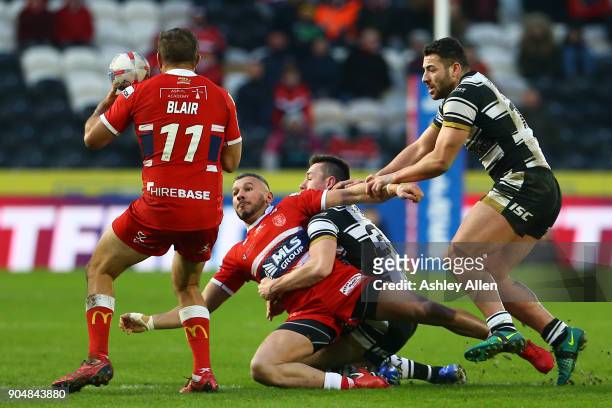 Hull KR's Liam Salter is tackled by Hull FC's Jack Sanderson during the Clive Sullivan Trophy, pre-season friendly match between Hull FC and Hull KR...