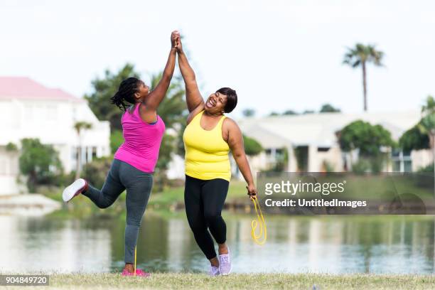women exercising outdoors - happi stock pictures, royalty-free photos & images