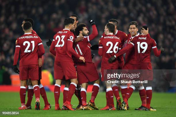 Mohamed Salah of Liverpool celebrates with team mates after scoring the fourth Liverpool goal during the Premier League match between Liverpool and...
