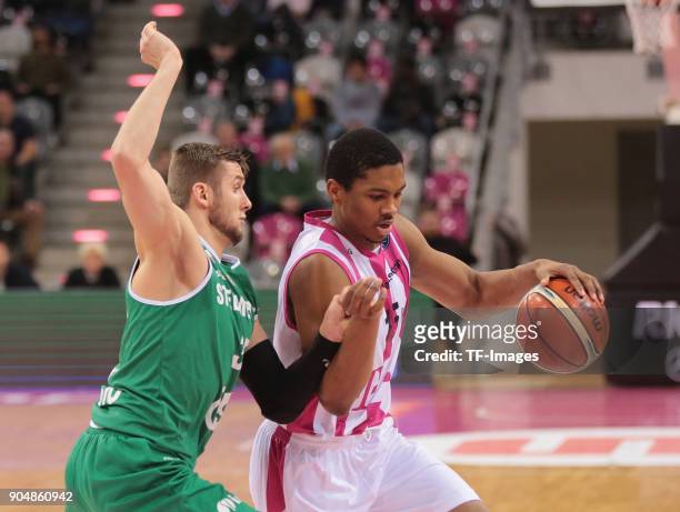 Malcolm Hill of Bonn and Przemyslaw Zamojski of Zielona Gora battle for the ball during the Basketball Champions League match between Telekom Baskets...